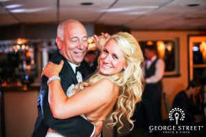 Bride and father of the bride dancing on an Anita Dee private yacht charter.