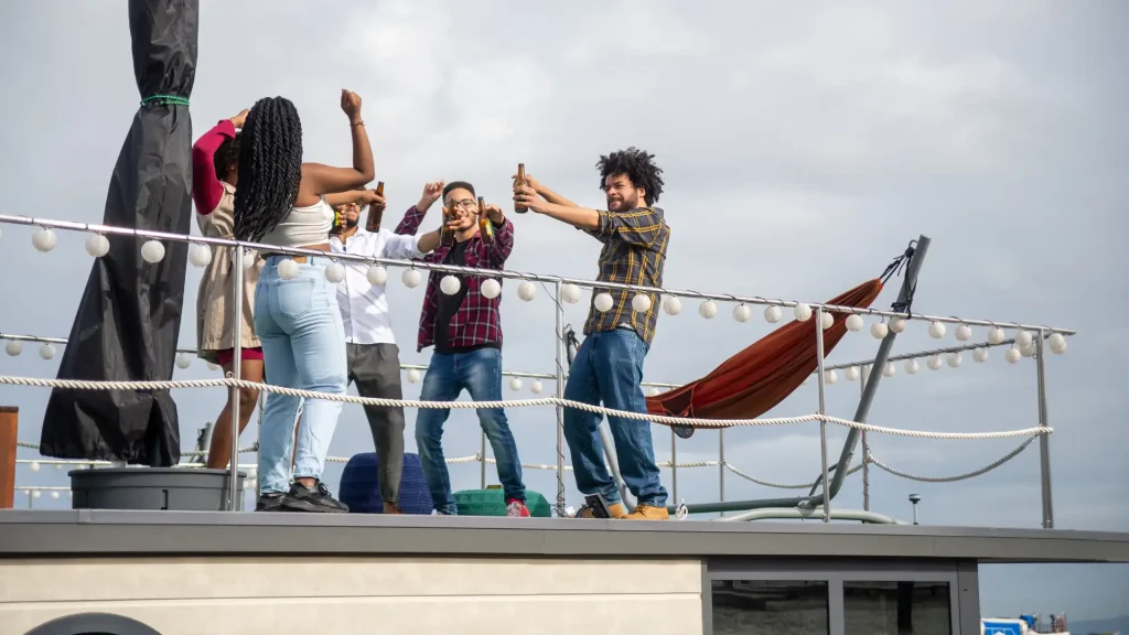 Friends dancing on a rooftop deck